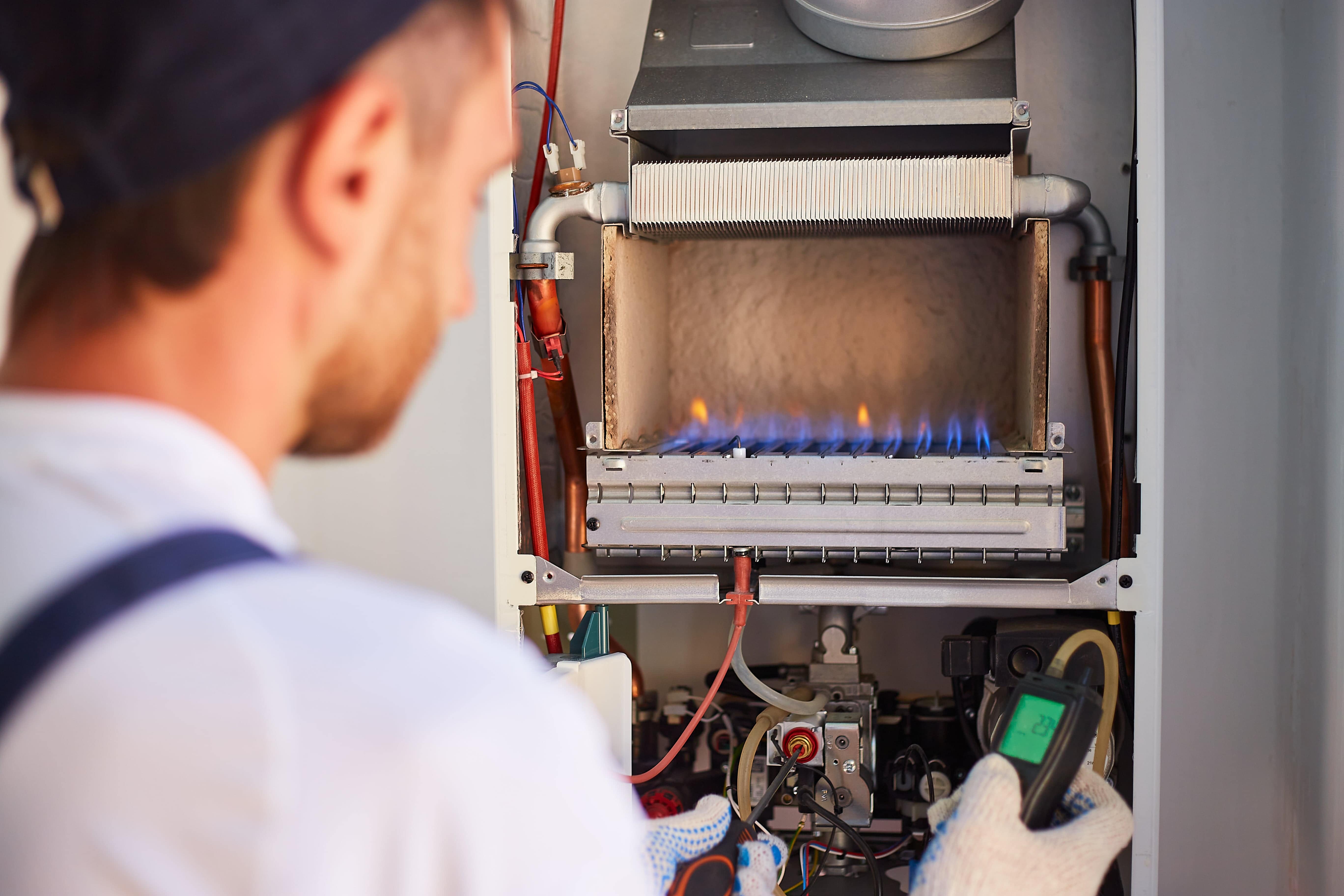 Engineer working on gas boiler