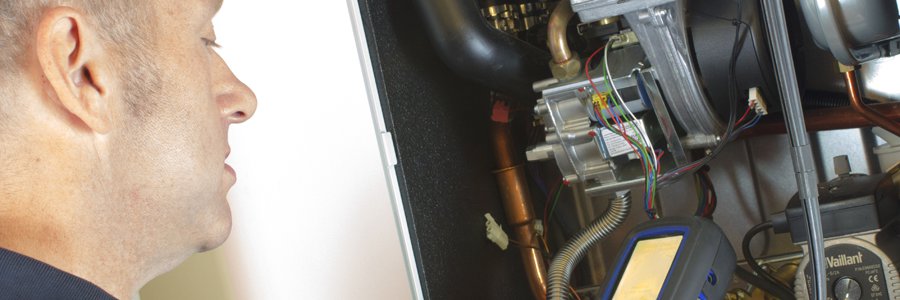 Engineer fixing a boiler
