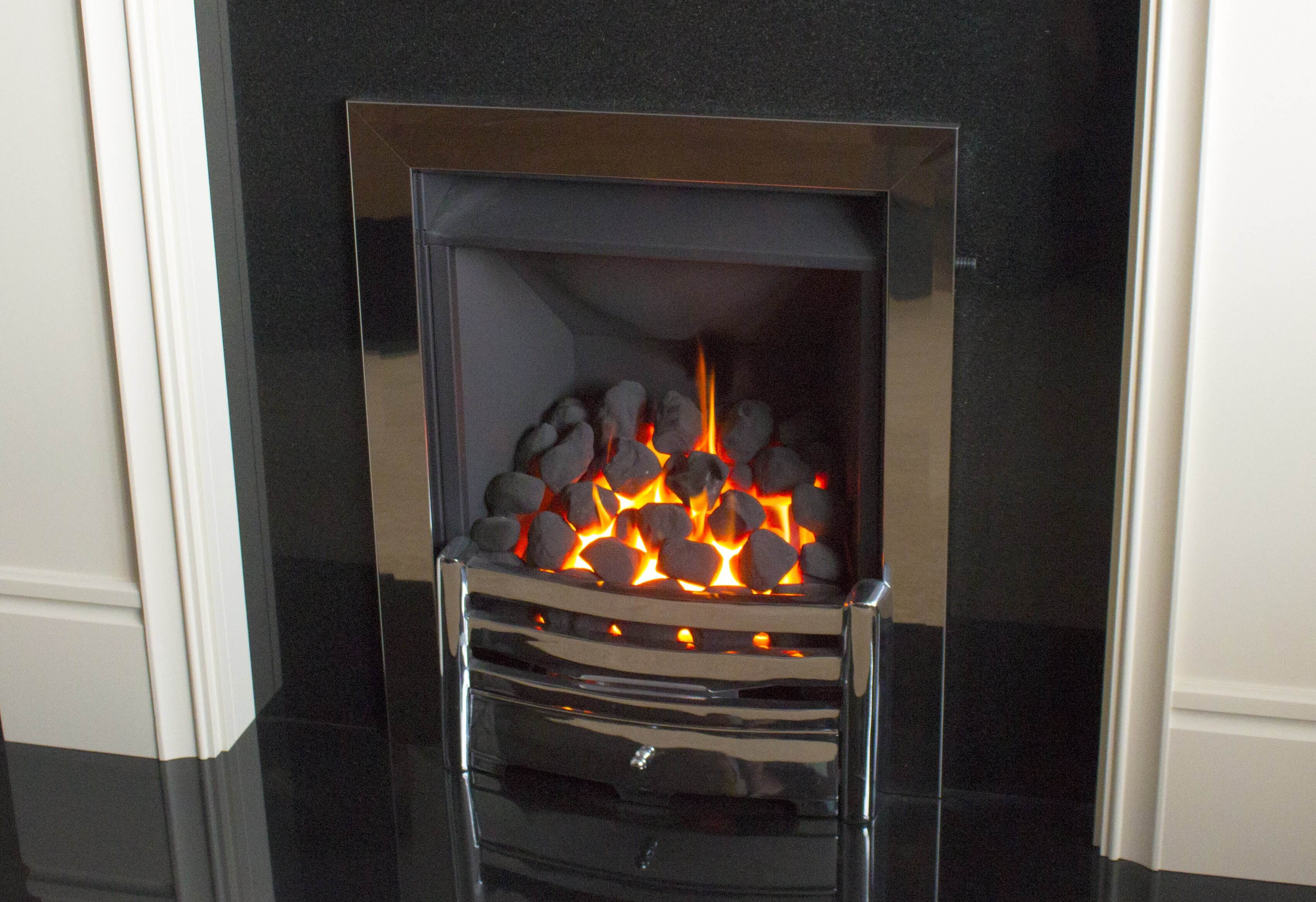 Photo of gas fireplace with chrome surround